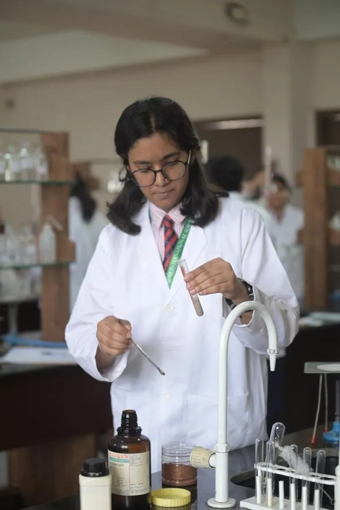 Chemistry lab student experimenting at  best CBSE school- Sapphire International school crossing republik, Ghaziabad